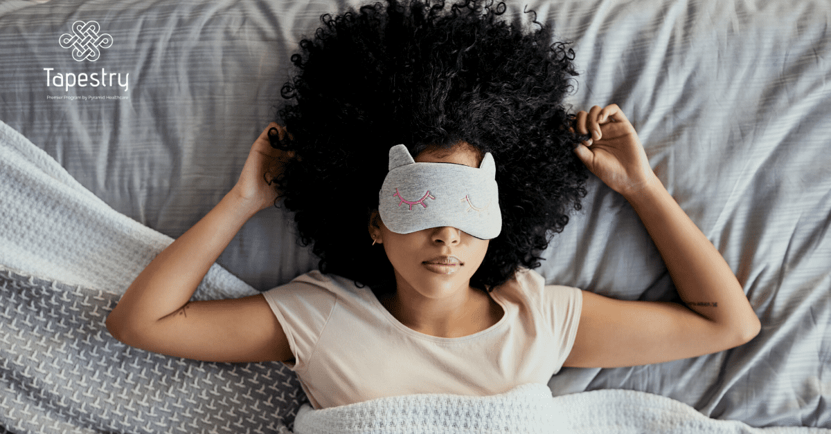 African American woman sleeping with her eye covers on
