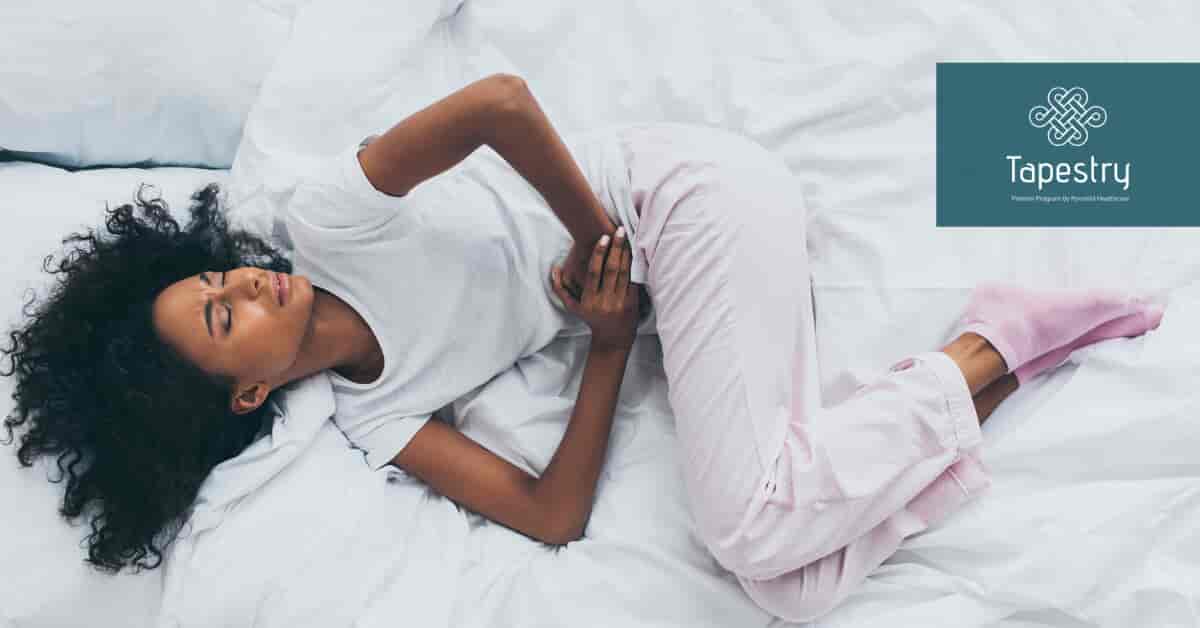 African American woman laying down on the bed