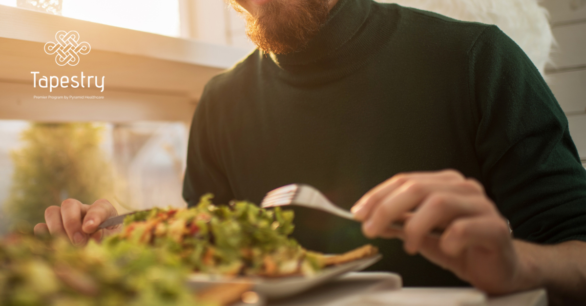 Man eating a salad