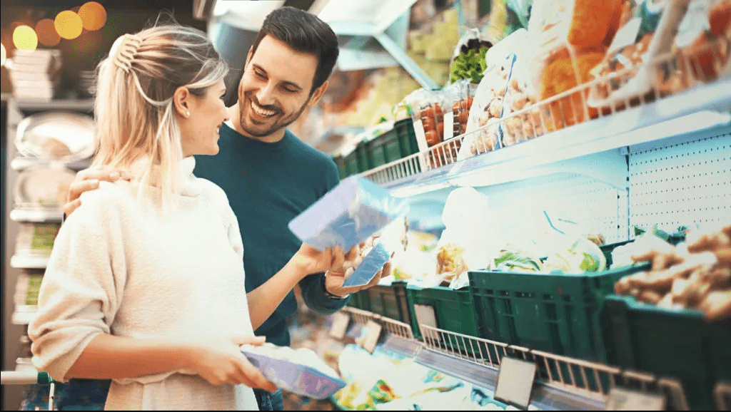 Couple grocery shopping together