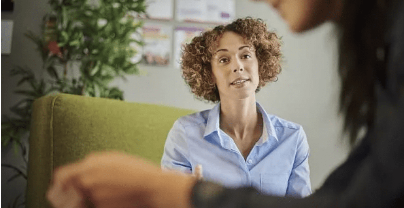 Therapist talking with her client during a session