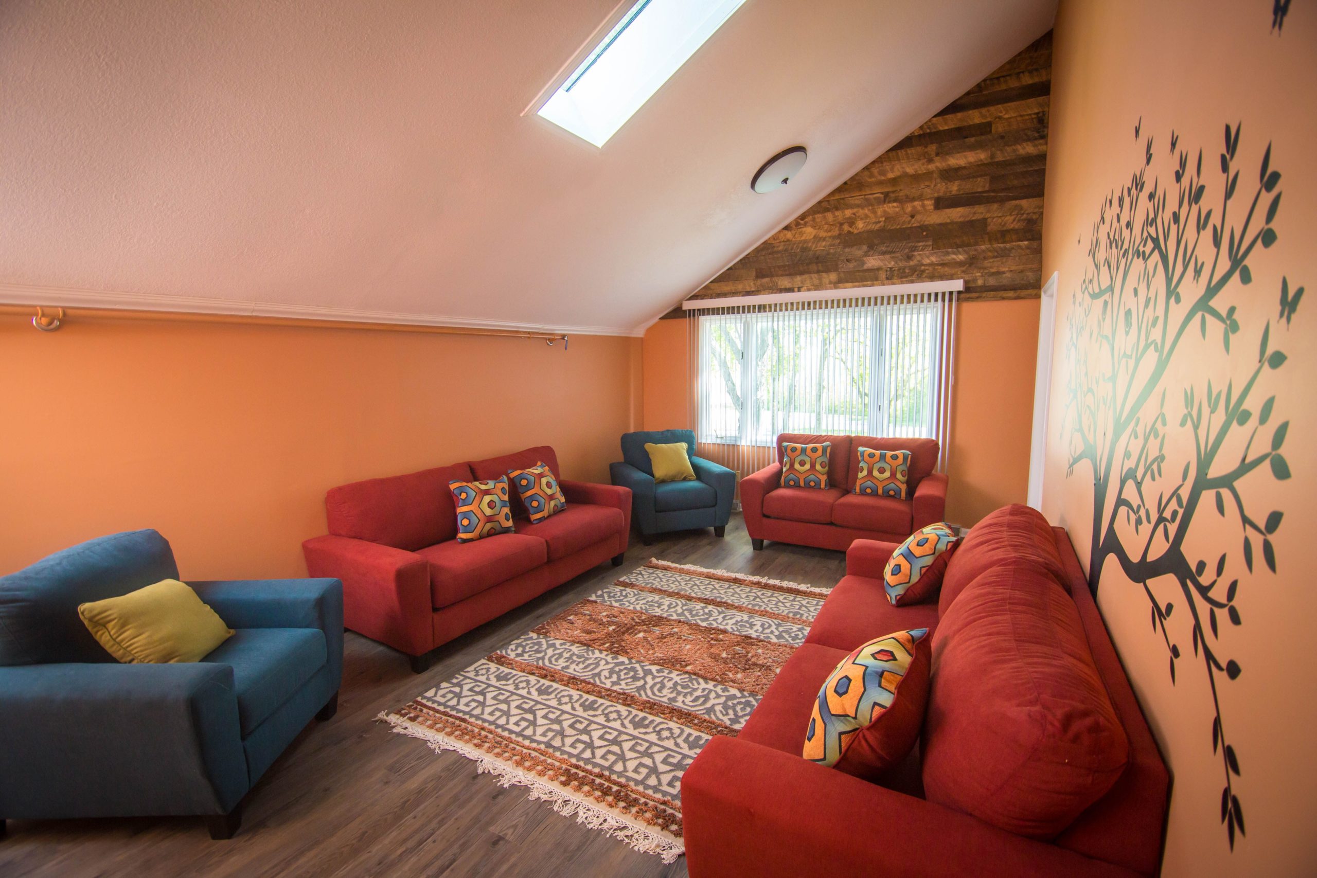 Tapestry Fletcher orange lounge Lounge area at Tapestry-Fletcher