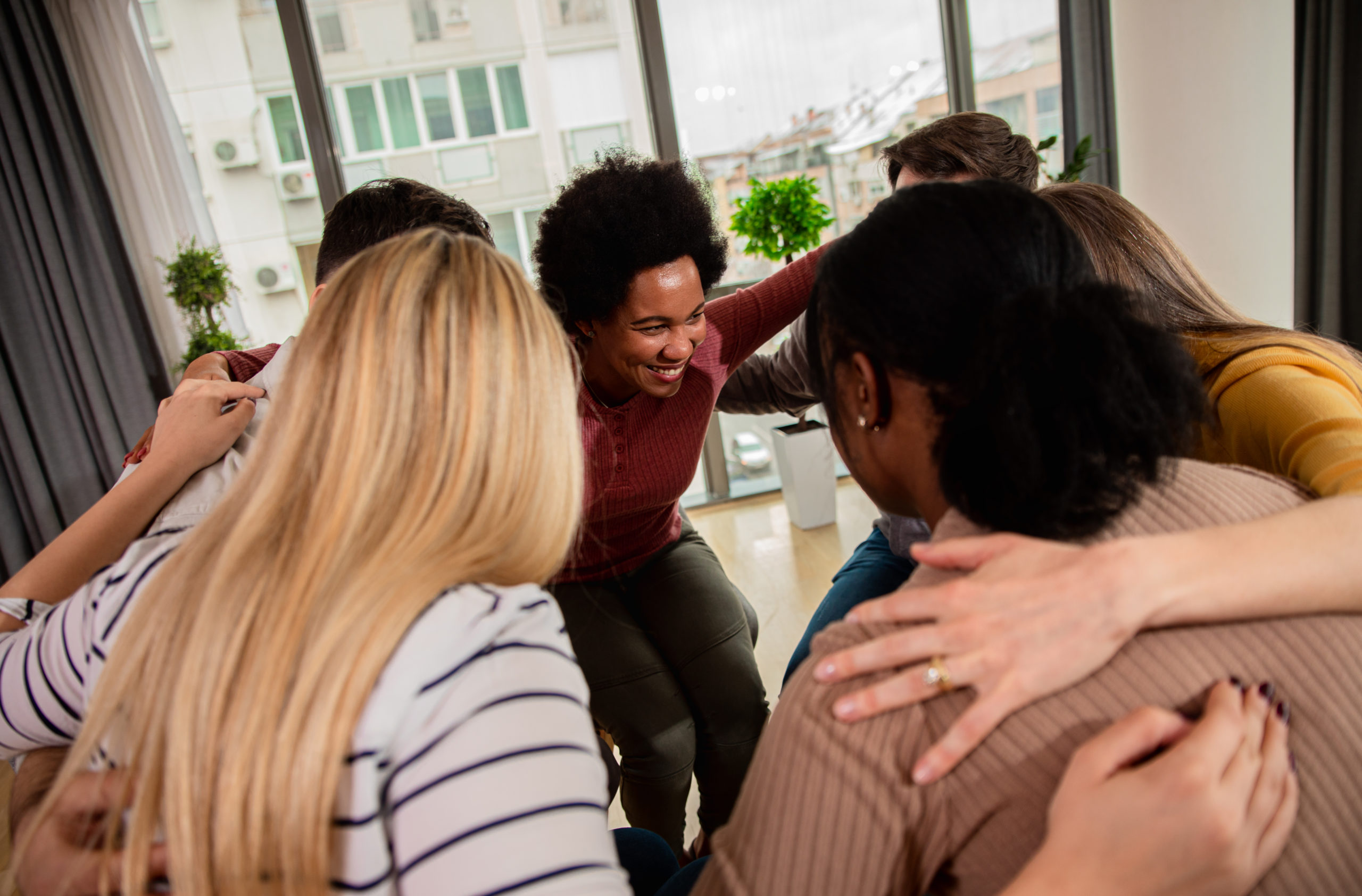 Diverse group of people in a group therapy session