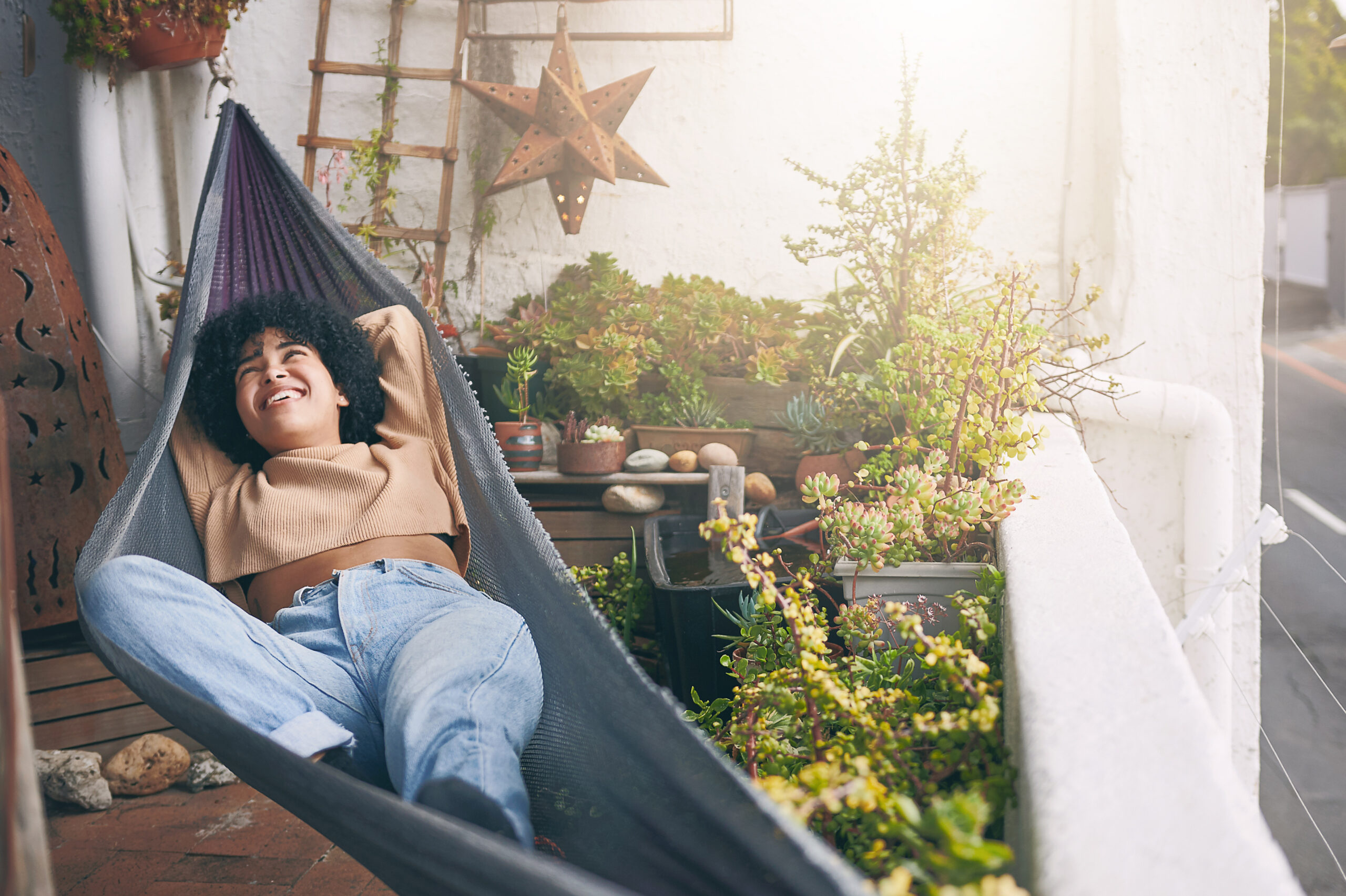 Young woman relaxing on a hammock outdoors