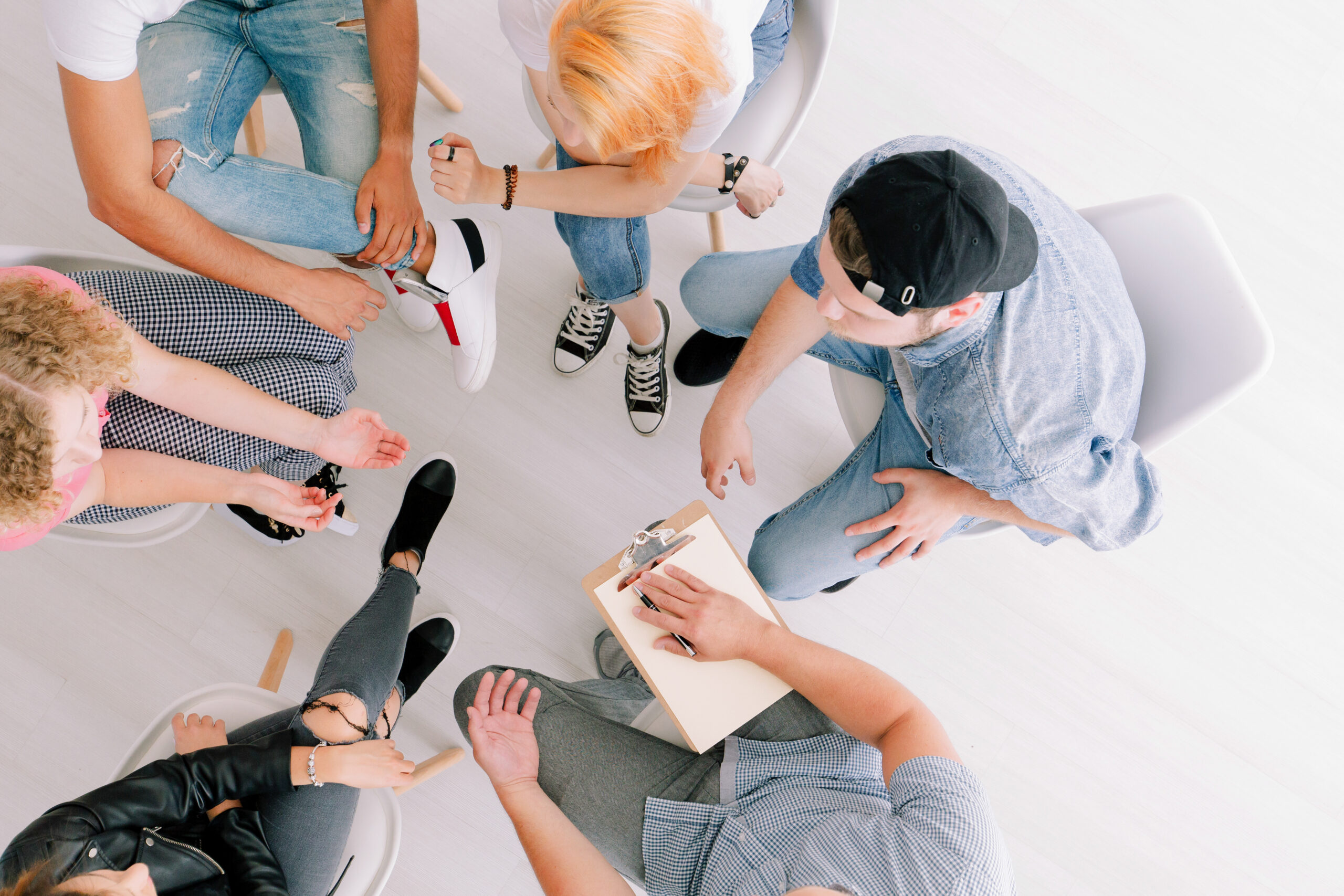 Teenagers sitting in group therapy