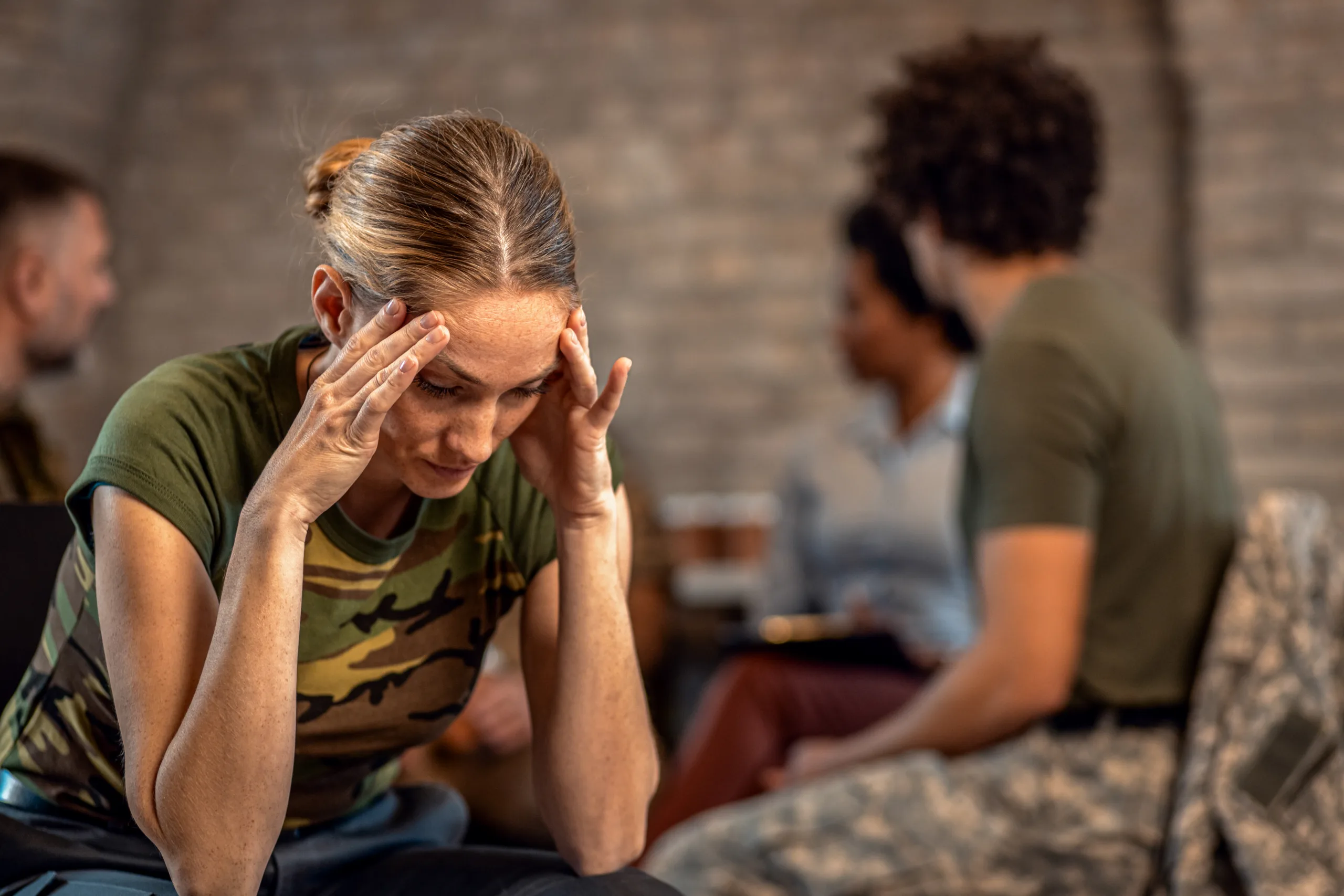 Portrait of female veteran in PTSD support group.